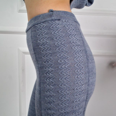 A close up of the knit pattern on the side of the leggings