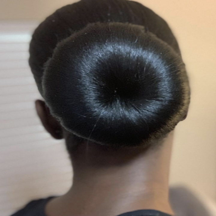 Reviewer photo of hair bun using donut hair bun maker