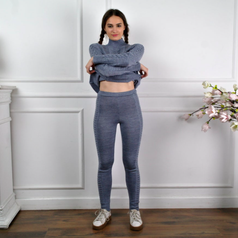 A person wearing the knit leggings with a matching sweater
