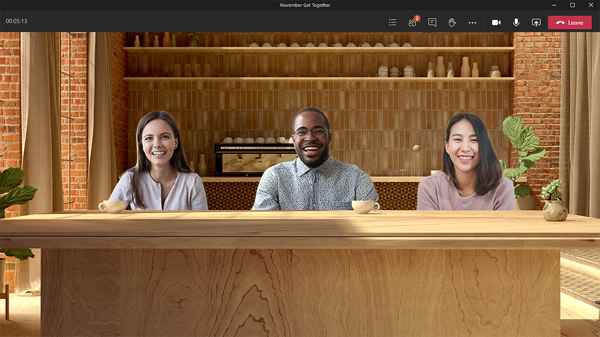 A person using the coffee shop background to video chat with coworkers
