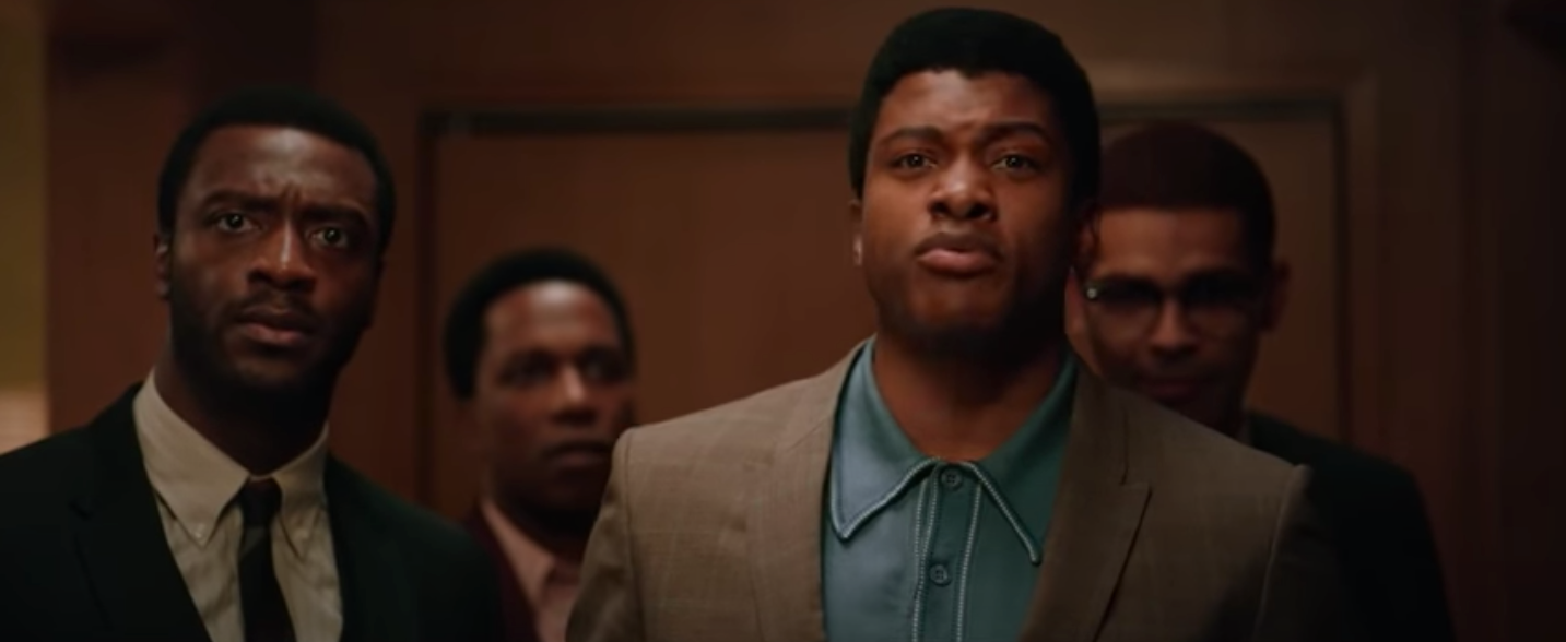 A screenshot of Aldis Hodge, Leslie Odom Jr., Eli Goree, and Kingsley Ben-Adir in character for "One Night In Miami"