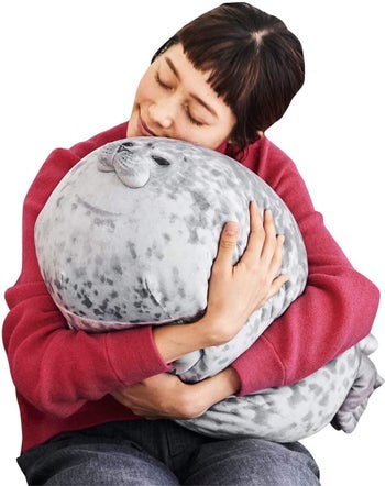A model hugging the seal pillow