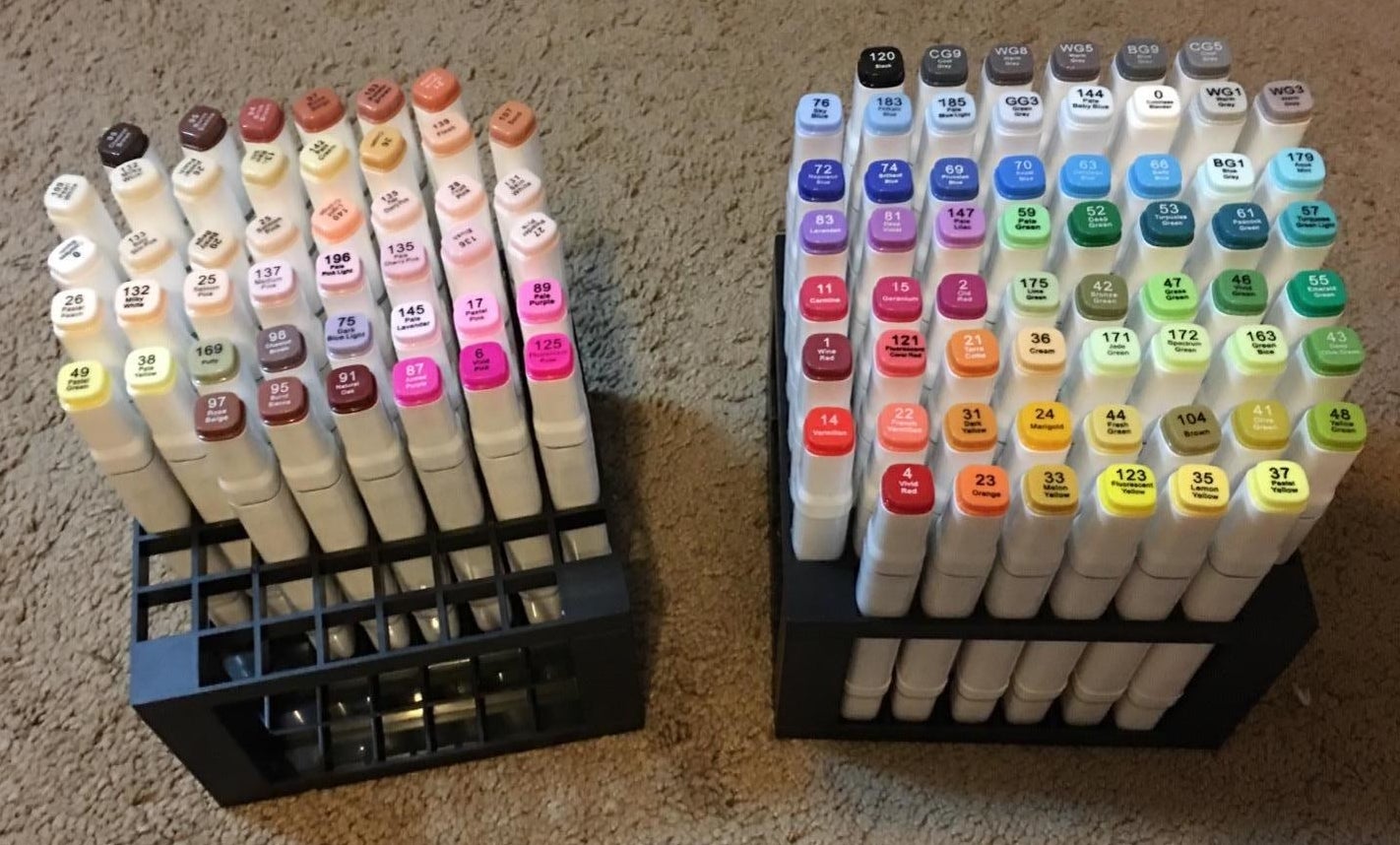 Top down shot of organized colorful artist pens