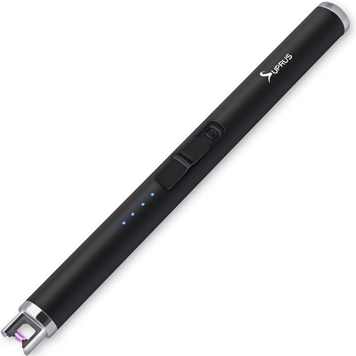 The slim, black electric lighter with a switch and indicator lights on the sides and a two-pronged tip 