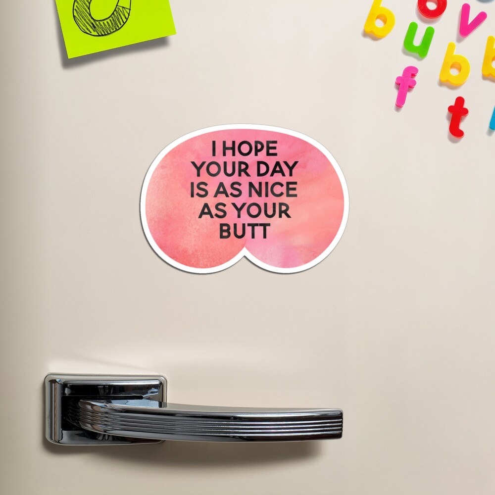 A pink magnet that reads &quot;I hope your day is as nice as your butt&quot; 