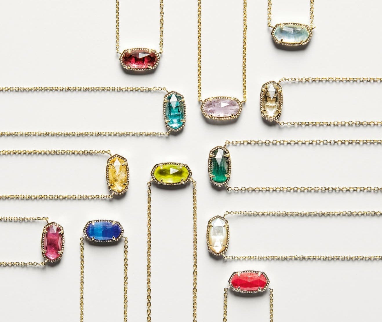 Twelves oval-shaped pendents in different-colored stones on cold chains