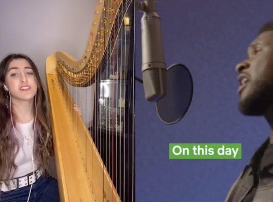 A woman sits at her harp and sings