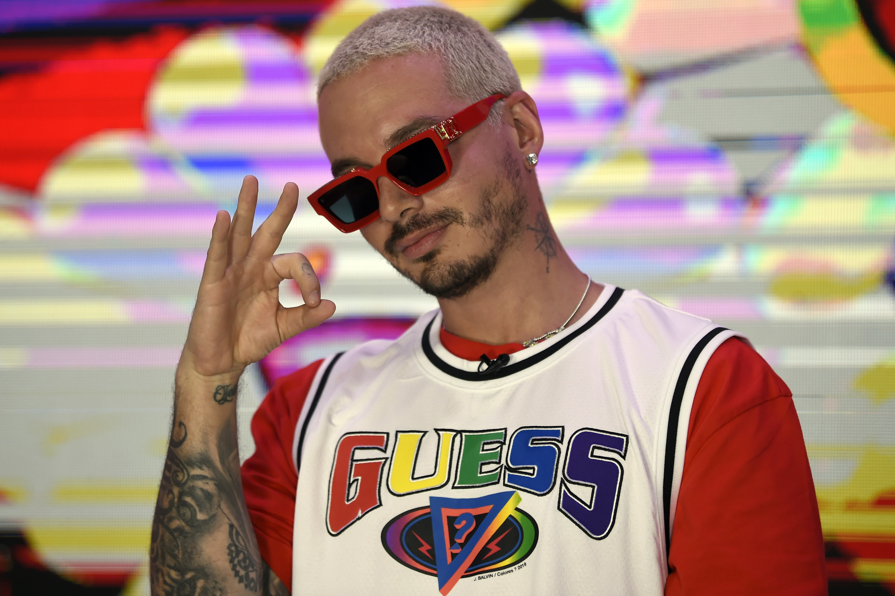 J Balvin, wearing a printed jacket, white turtleneck sweater and News  Photo - Getty Images