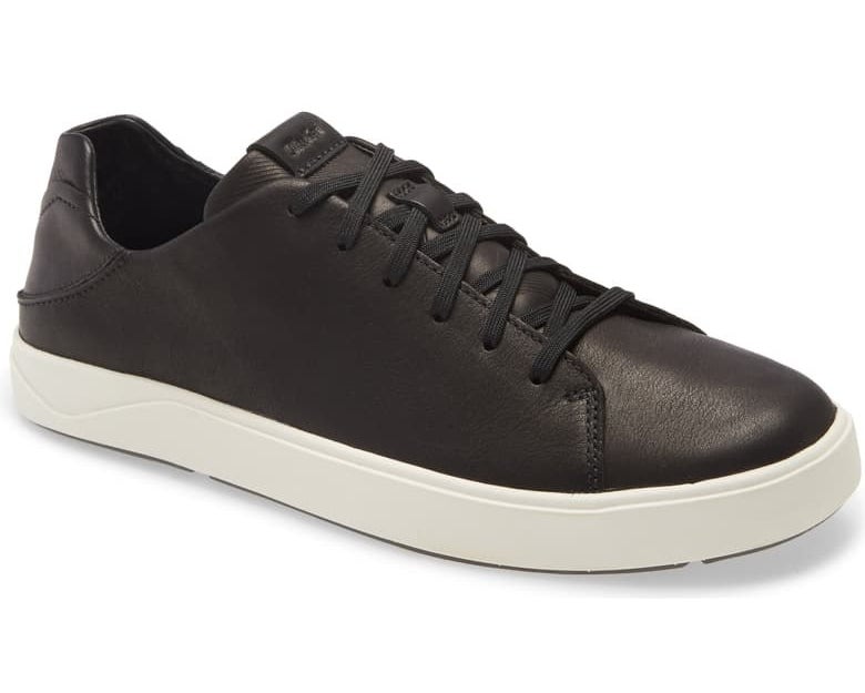 The sneakers in black with black laces and a white sole