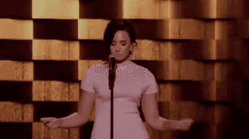 GIF of Demi dancing onstage