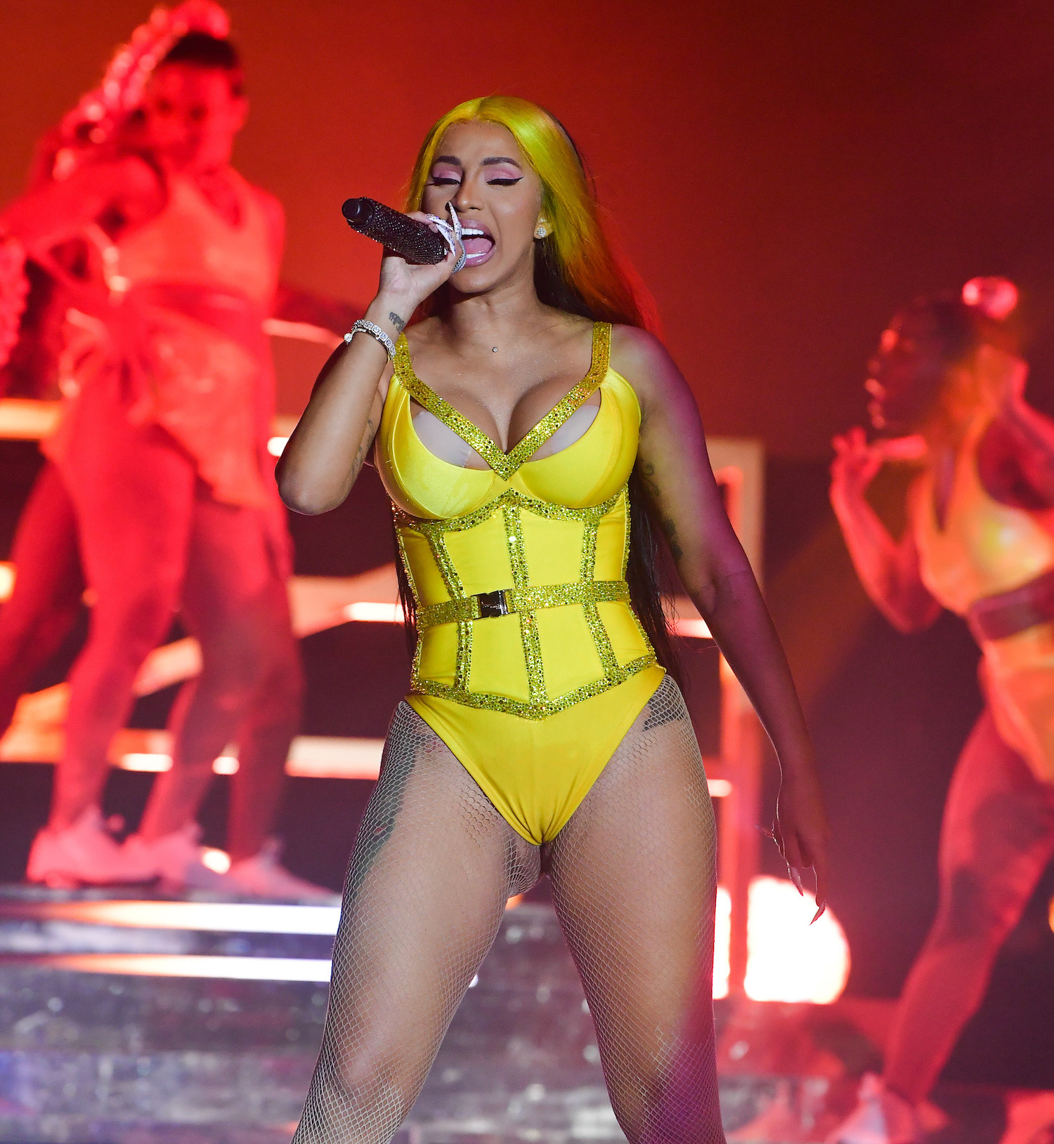 Cardi B performs at Vewtopia Music Festival 2020 in a bedazzled bodysuit and long hair
