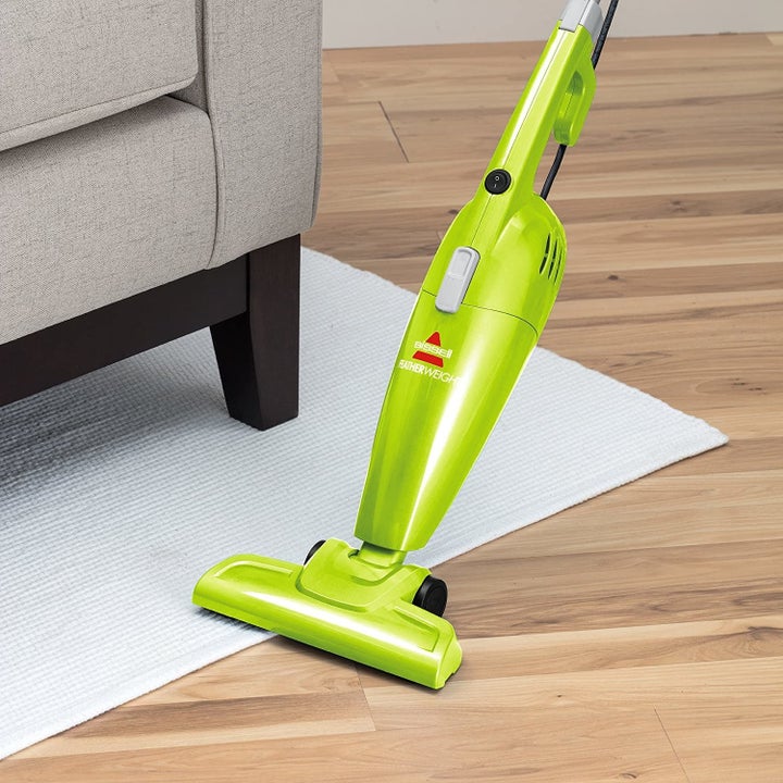 The vacuum being used to clean a hardwood floor