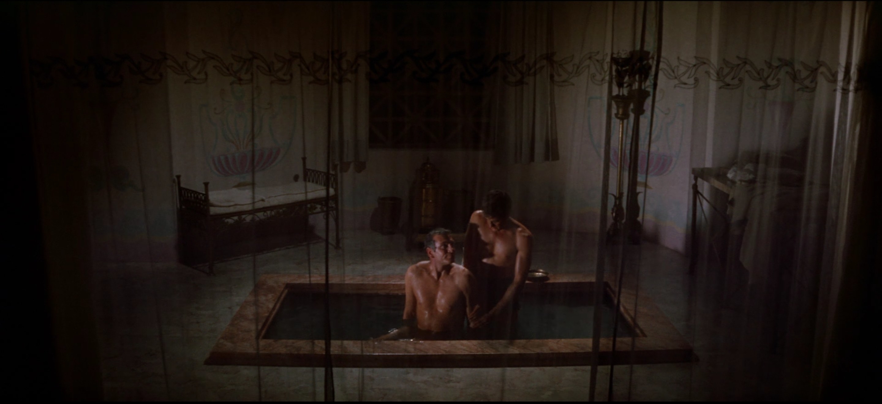Two men in a Roman-style bathtub