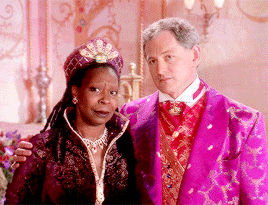 GIF of Queen Constantina and King Maximilian smirking at each other