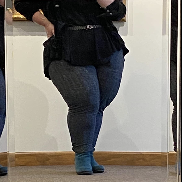 Reviewer in houndstooth pattern joggers dressed up with work clothes 