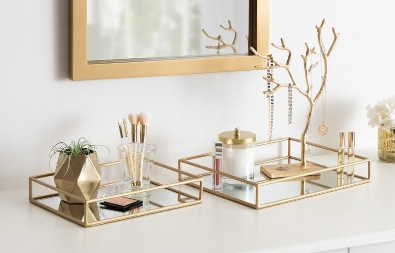 gold and mirrored vanity trays