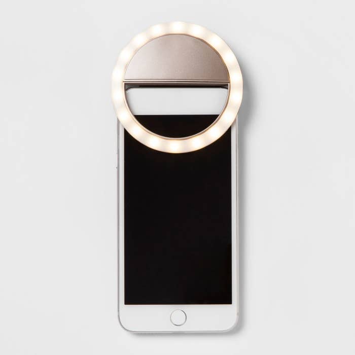 The light, which is circular and clips onto the top of the phone