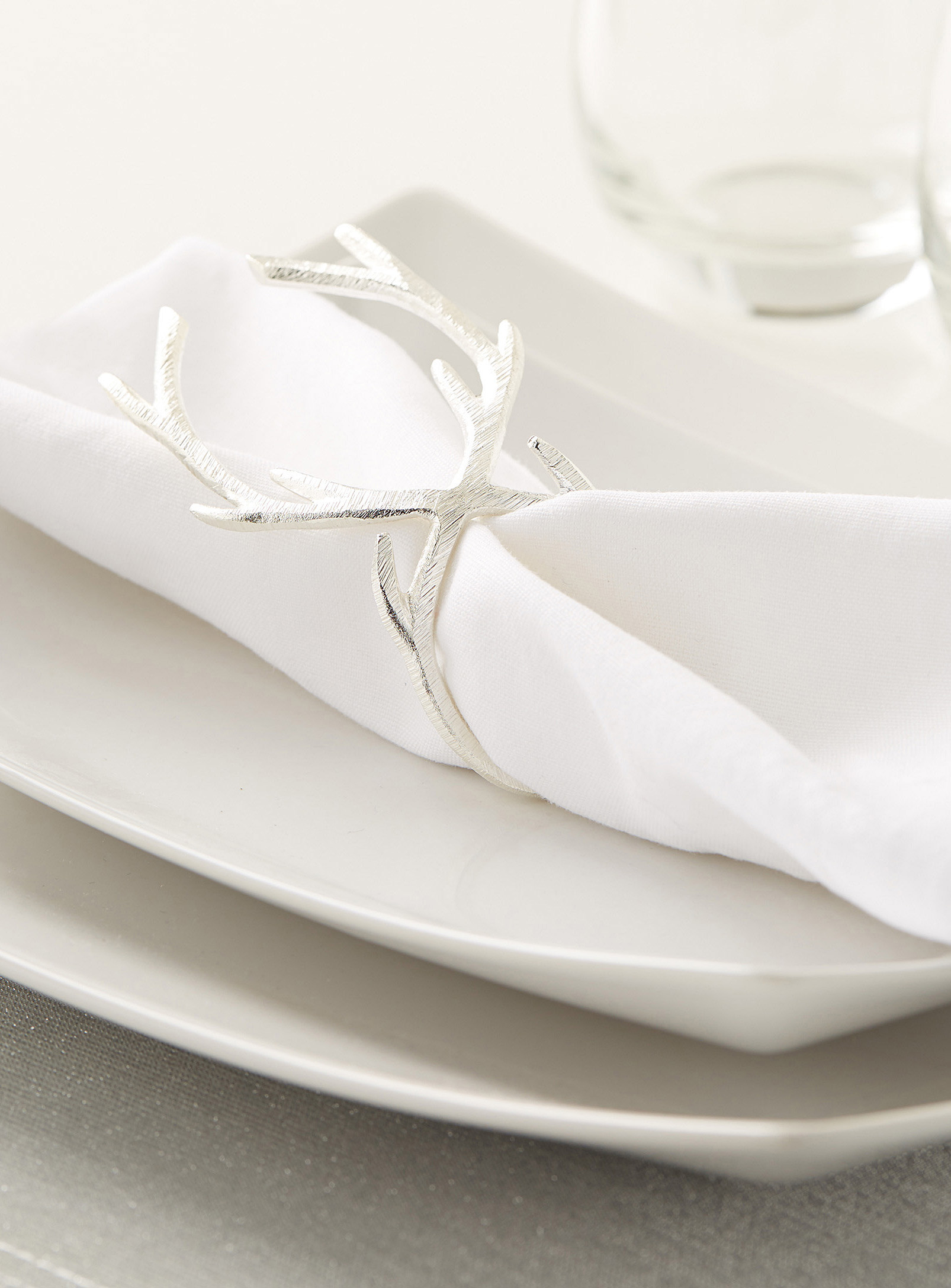 A napkin ring shaped like antlers