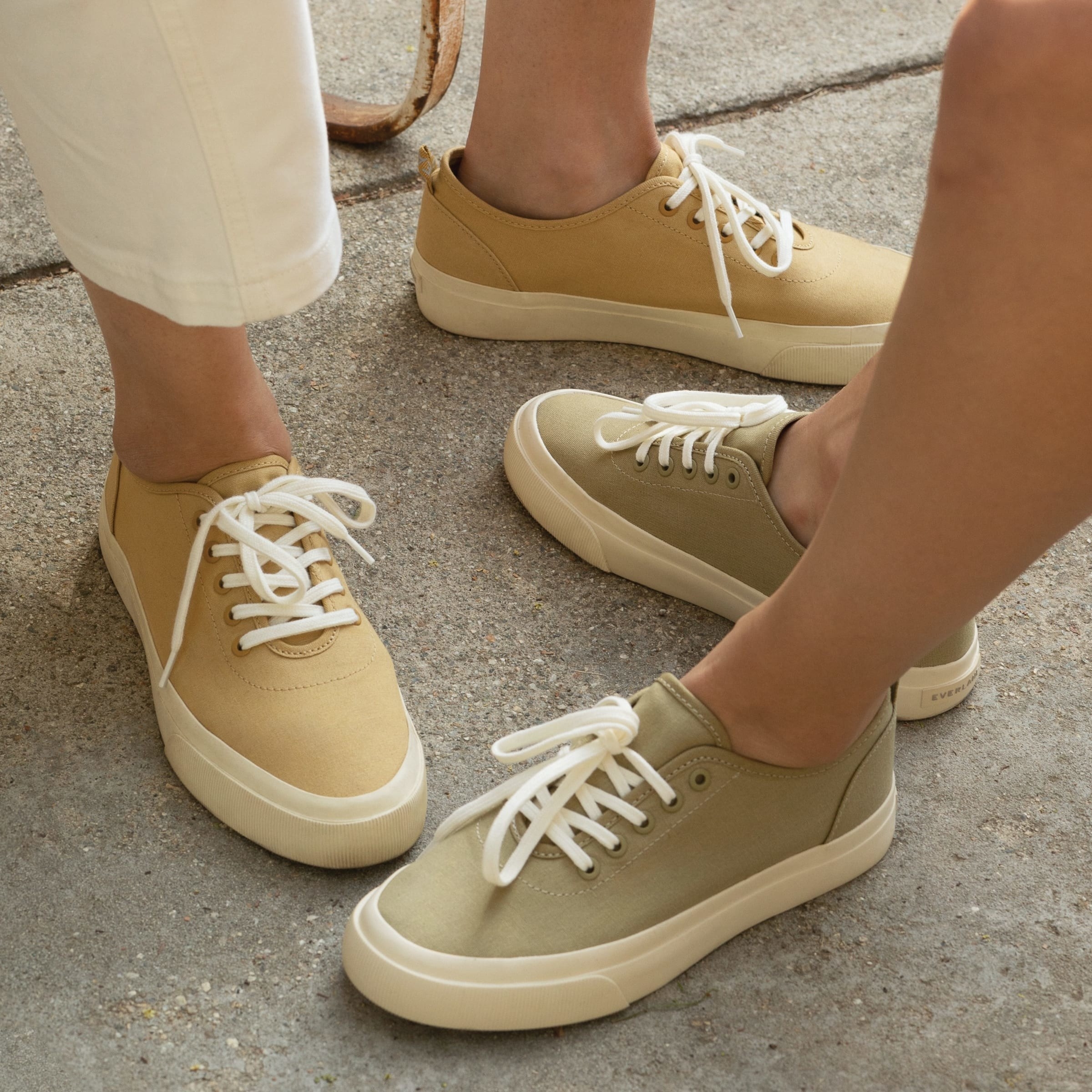 Models wearing the sneakers in teak and sycamore