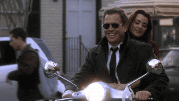 Tony and Ziva on a motorcycle
