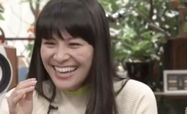 A Japanese woman laughs