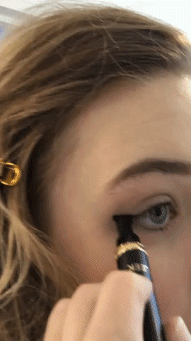BuzzFeed writer gif showing how to apply Eyeliner Stamp