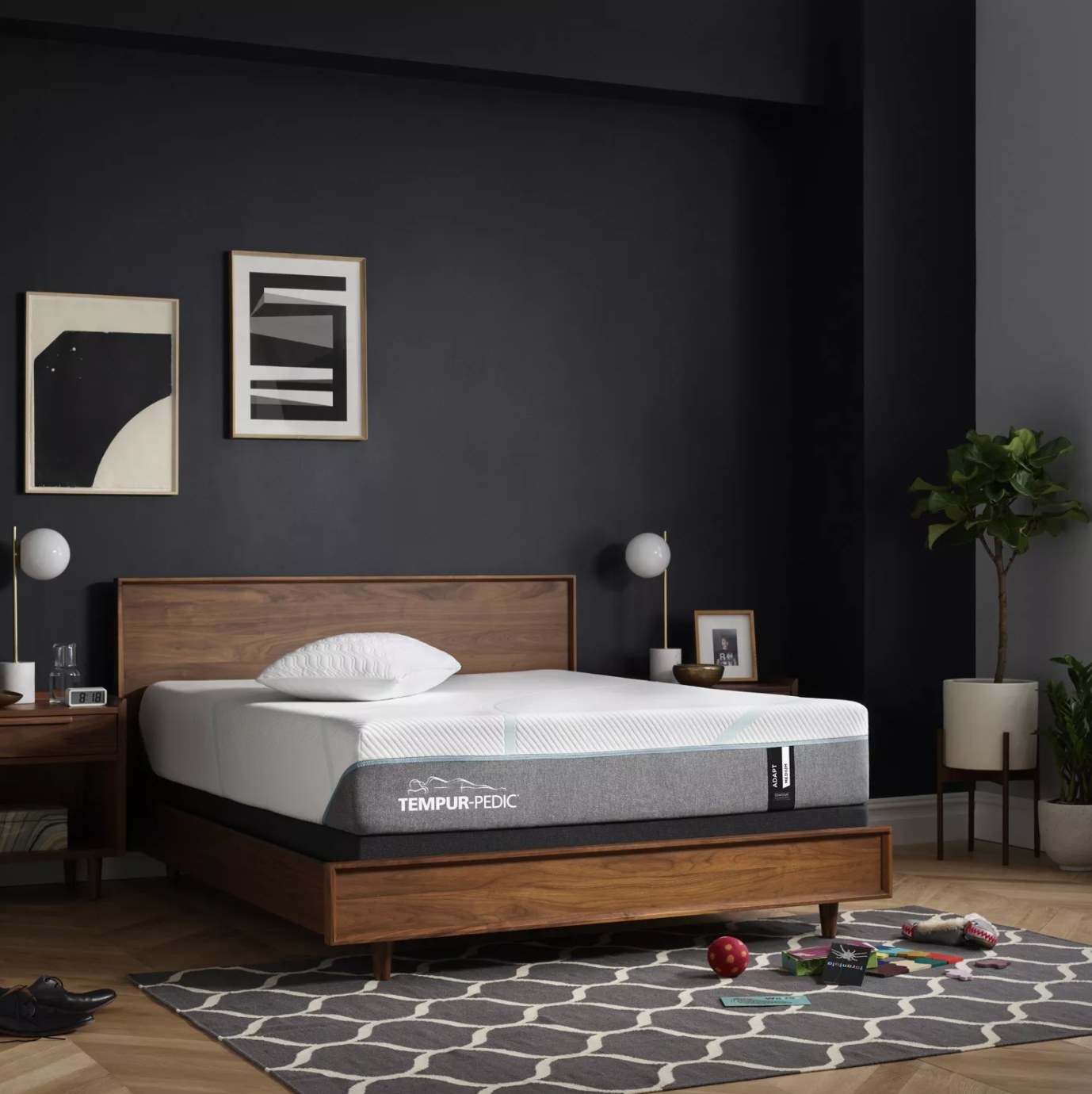 The pressure-relieving king-sized mattress on a wood bed frame