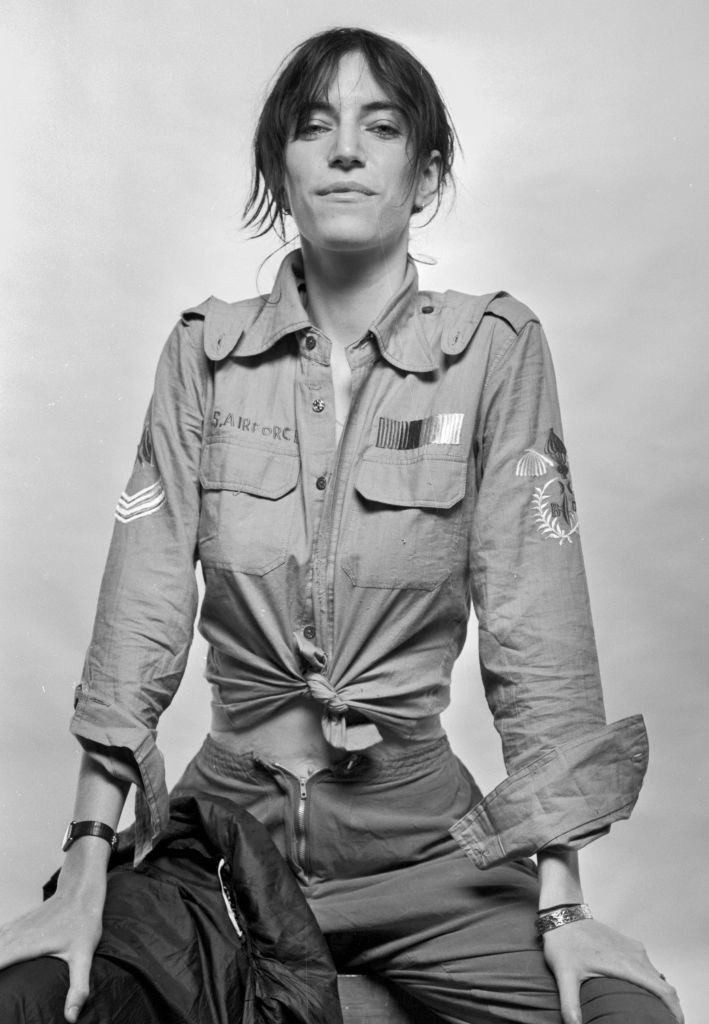 Patti Smith wearing a US Air Force shirtin a black and white photograph, mid-70s
