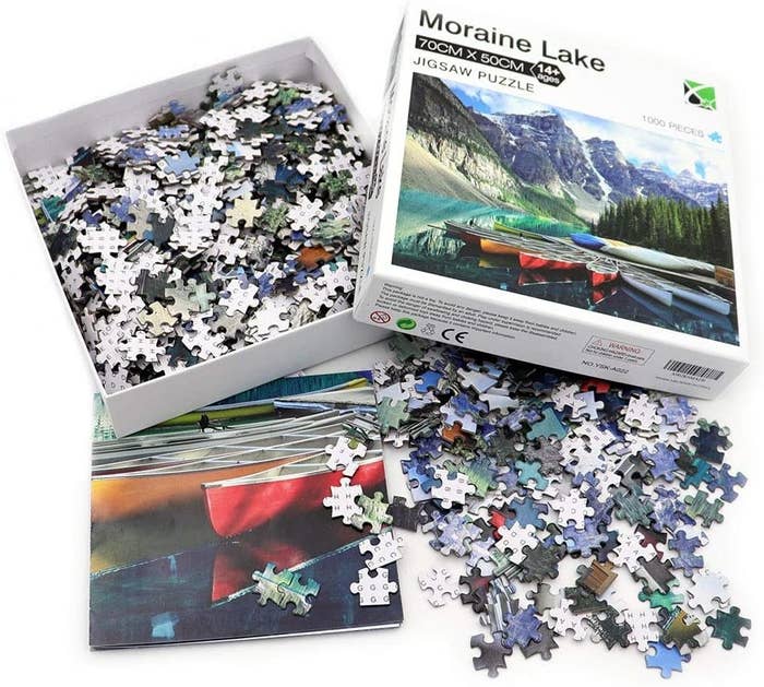 the agirlgle moraine lake puzzle, its pieces, and a folded poster