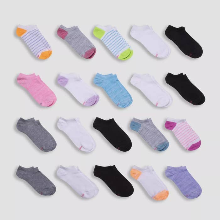 Twenty pairs of socks in various colors and patterns