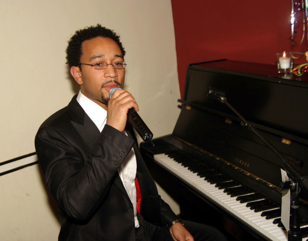 John Legend singing and playing piano at his birthday dinner in 2004
