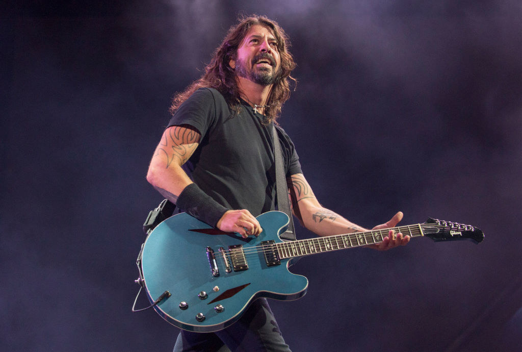 Dave Grohl performing with the Foo Fighters in 2018, playing guitar