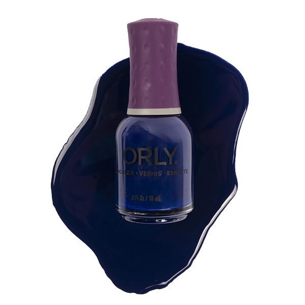 Bottle of ORLY nail polish in the shade Saturated with product swatch in the background
