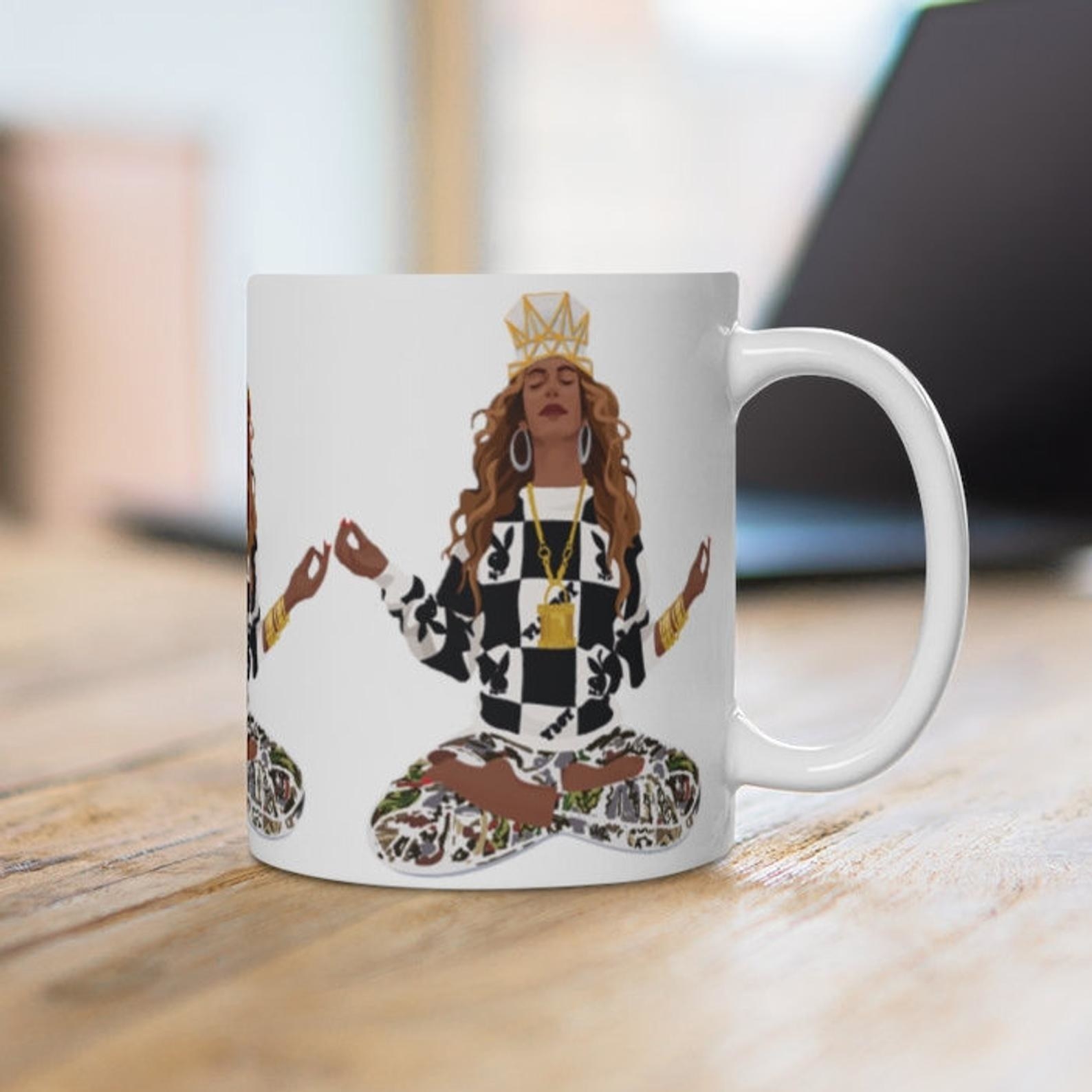 An illustration of Beyoncé on a white mug 