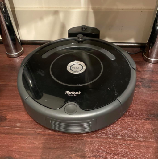 reviewer photo of the iRobot on their hardwood floors