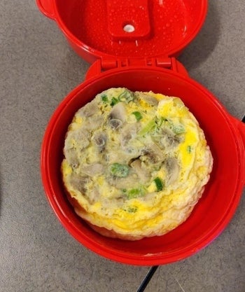 A reviewer photo of an omelet they made inside the cooker