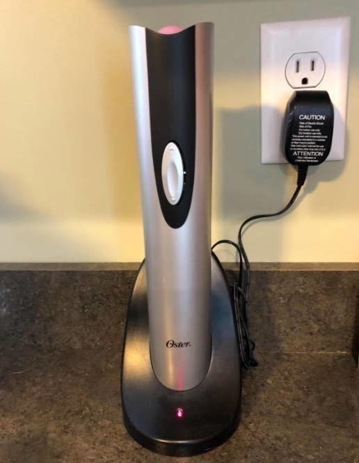 A reviewer photo of the electric wine opener being charged