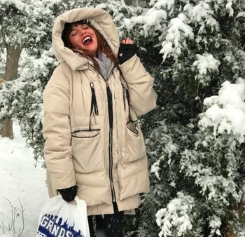 reviewer in jacket near snow