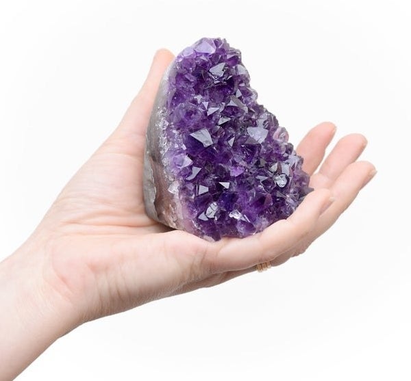 A person holding the geode