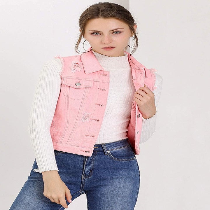 A model wearing the vest in pink