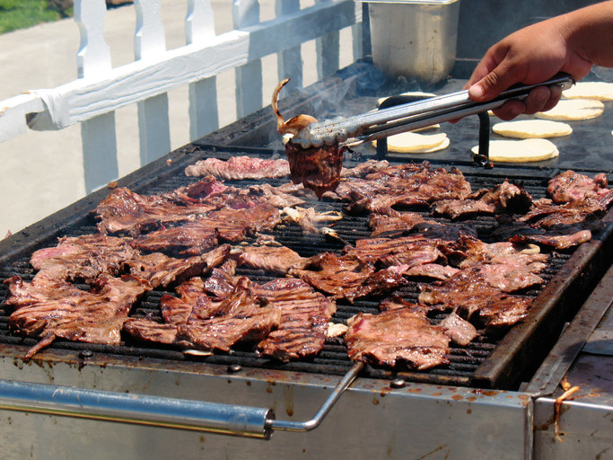 carne asada on a grill