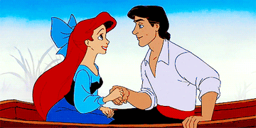 Ariel and Eric hold hands on a boat