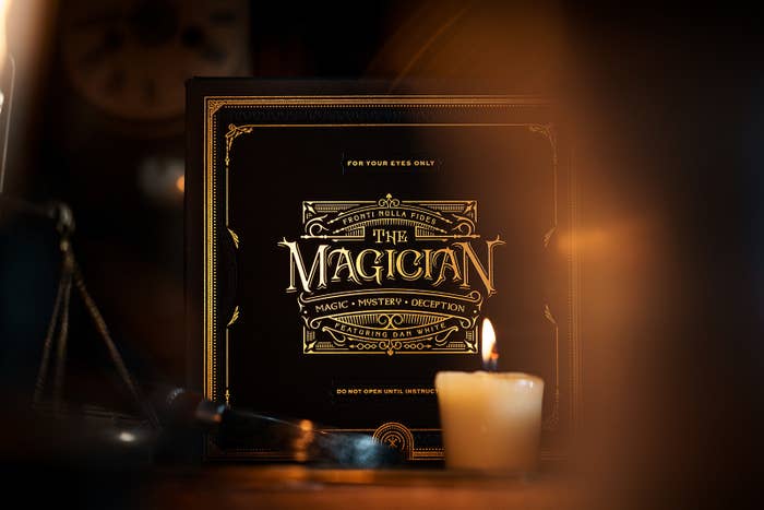 A box with ornate type that reads "For your eyes only; The Magician; Magic • Mystery • Deception; Featuring Dan White"
