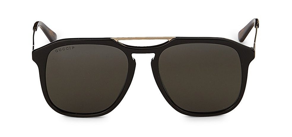 The black frame sunglasses in an aviator shape with gold browbar