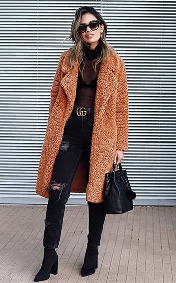 model wearing the camel color faux shearling jacket 