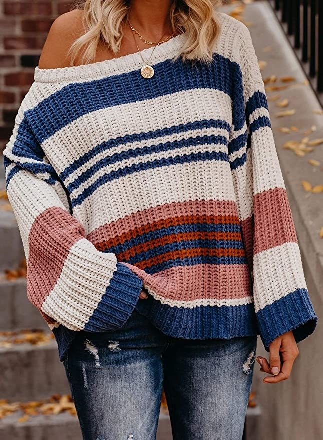 model wearing off the shoulder sweater with a stripe print a wide sleeves