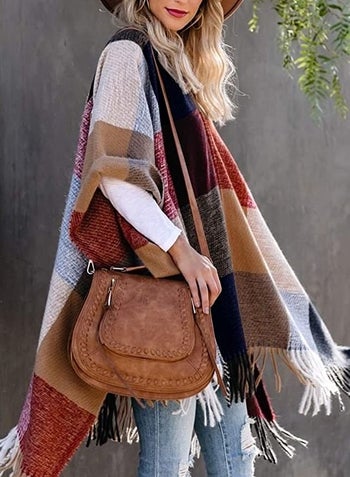 Model wearing the large plaid print shawl 