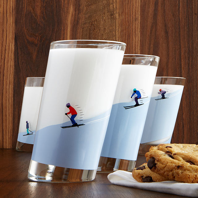 slanted glasses with skiers on them with blue slopes 
