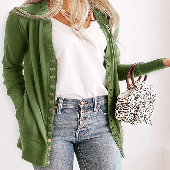 model wearing green cardigan