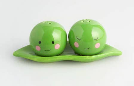 A salt and pepper shaker shaped like peas